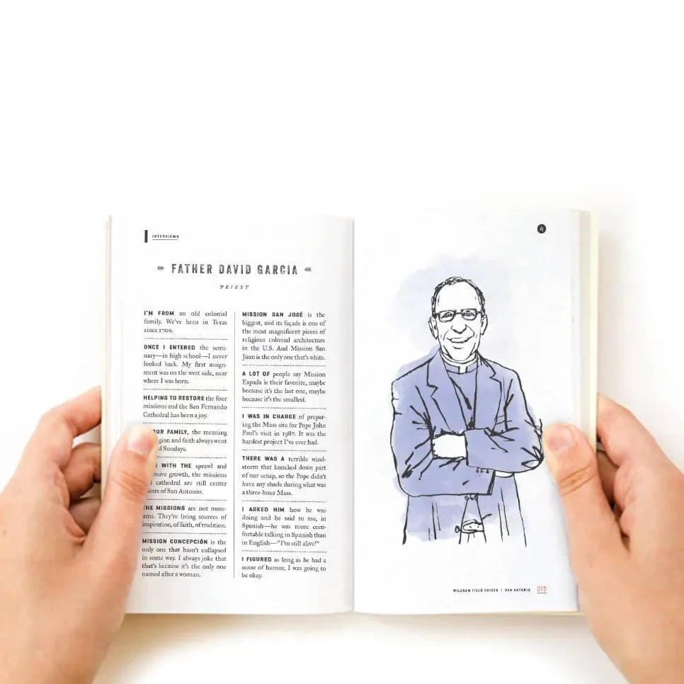 Person holding a book open to a page with text and an illustration of a person in a blue shirt.