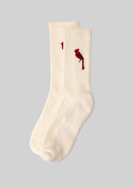 White crew sock with red bird designs on a gray background