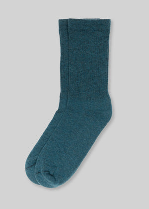 ddf44a78b314030242a7fa2adc7a6d0448e30f27931a42af516f5e44391428f7 front view blue crew socks on gray background