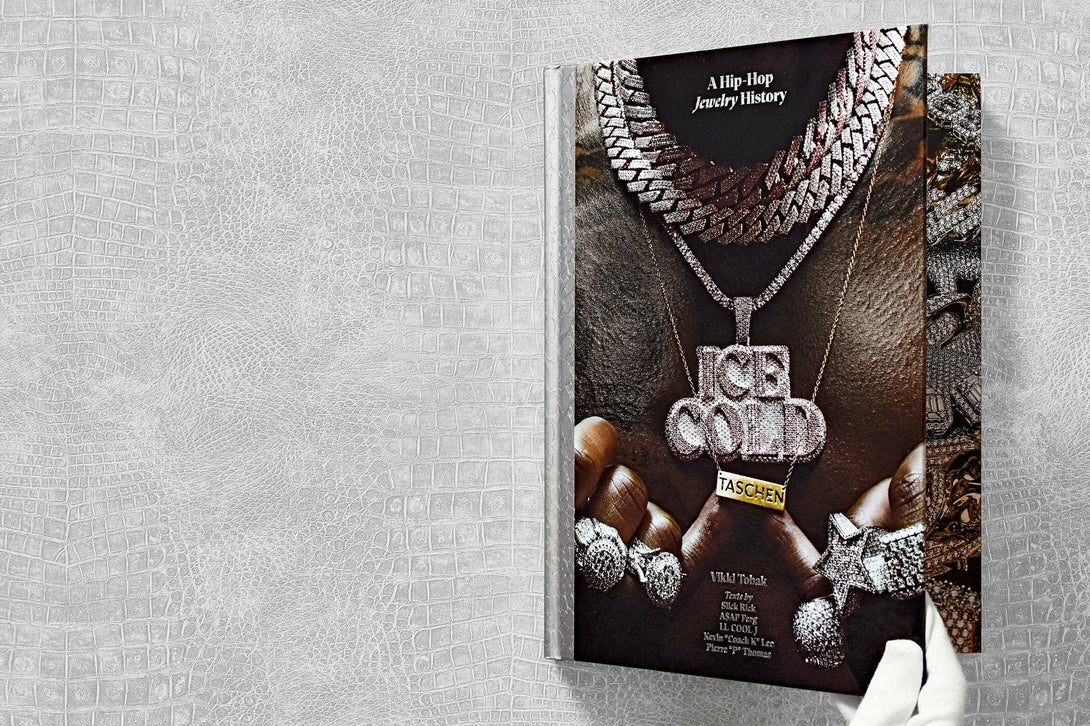 Book titled 'A Hip Hop Jewelry History' with jewelry images on a textured gray background