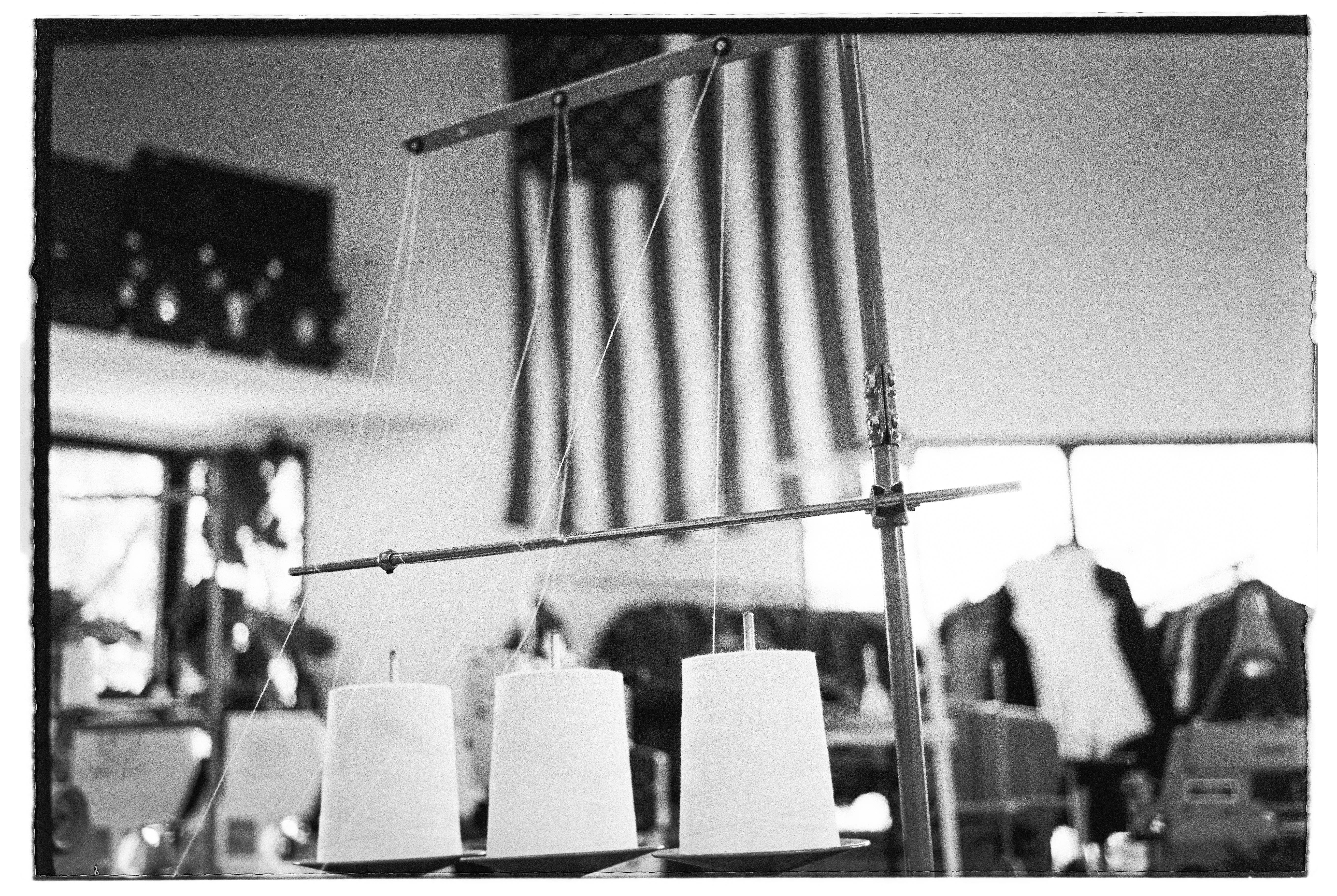 JL_8790_TriX_400_370208-R1-E010, three spools of thread on sewing equipment, factory setting