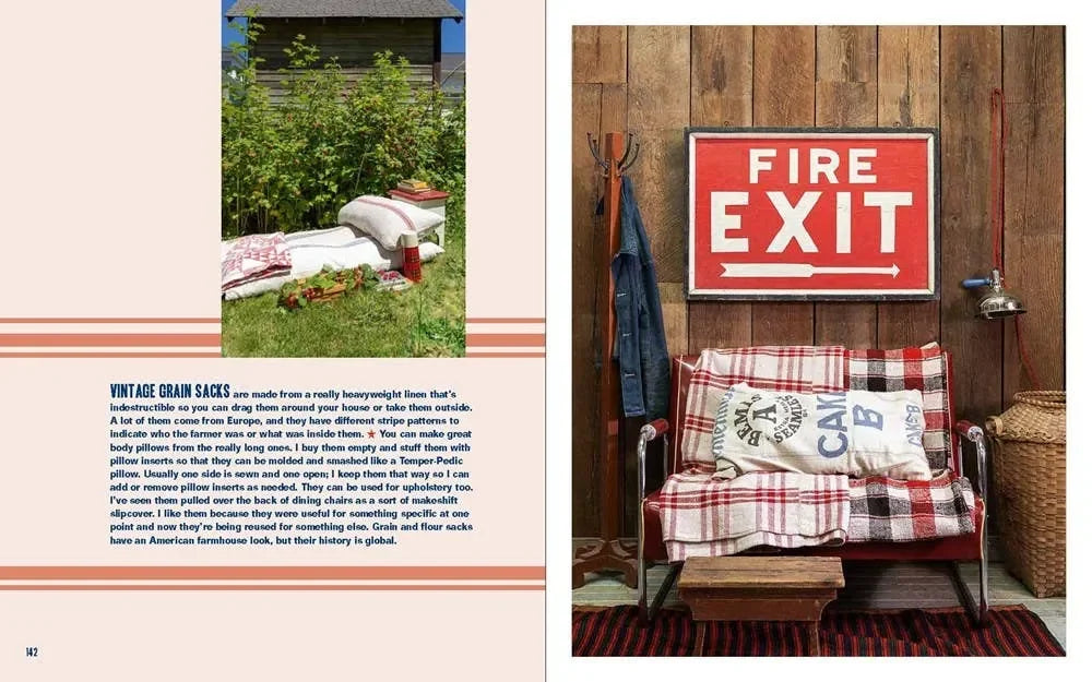Vintage-style interior with plaid blanket, pillows, and 'Fire Exit' sign.