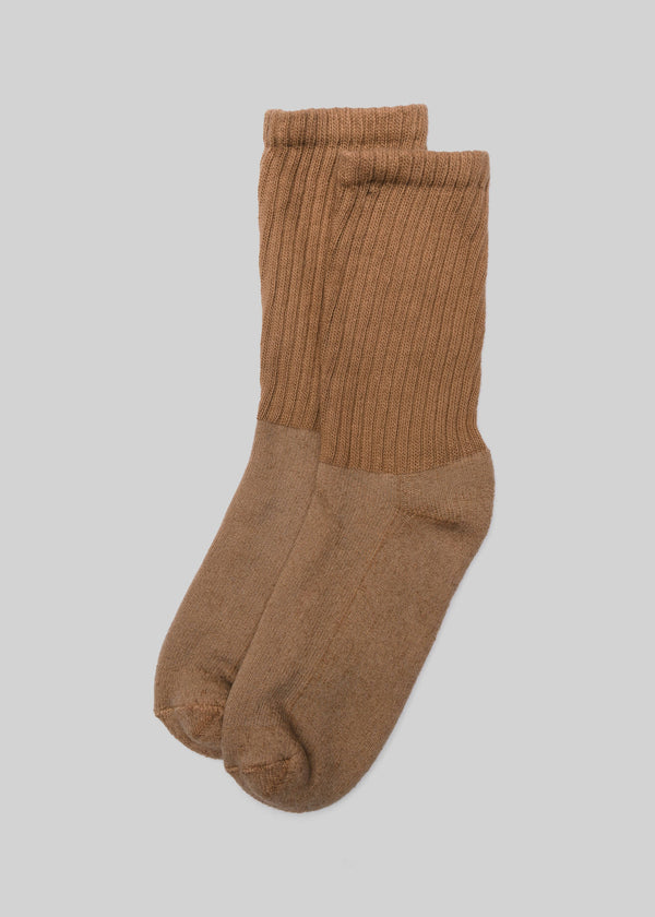 Pair of brown socks on a light gray background
