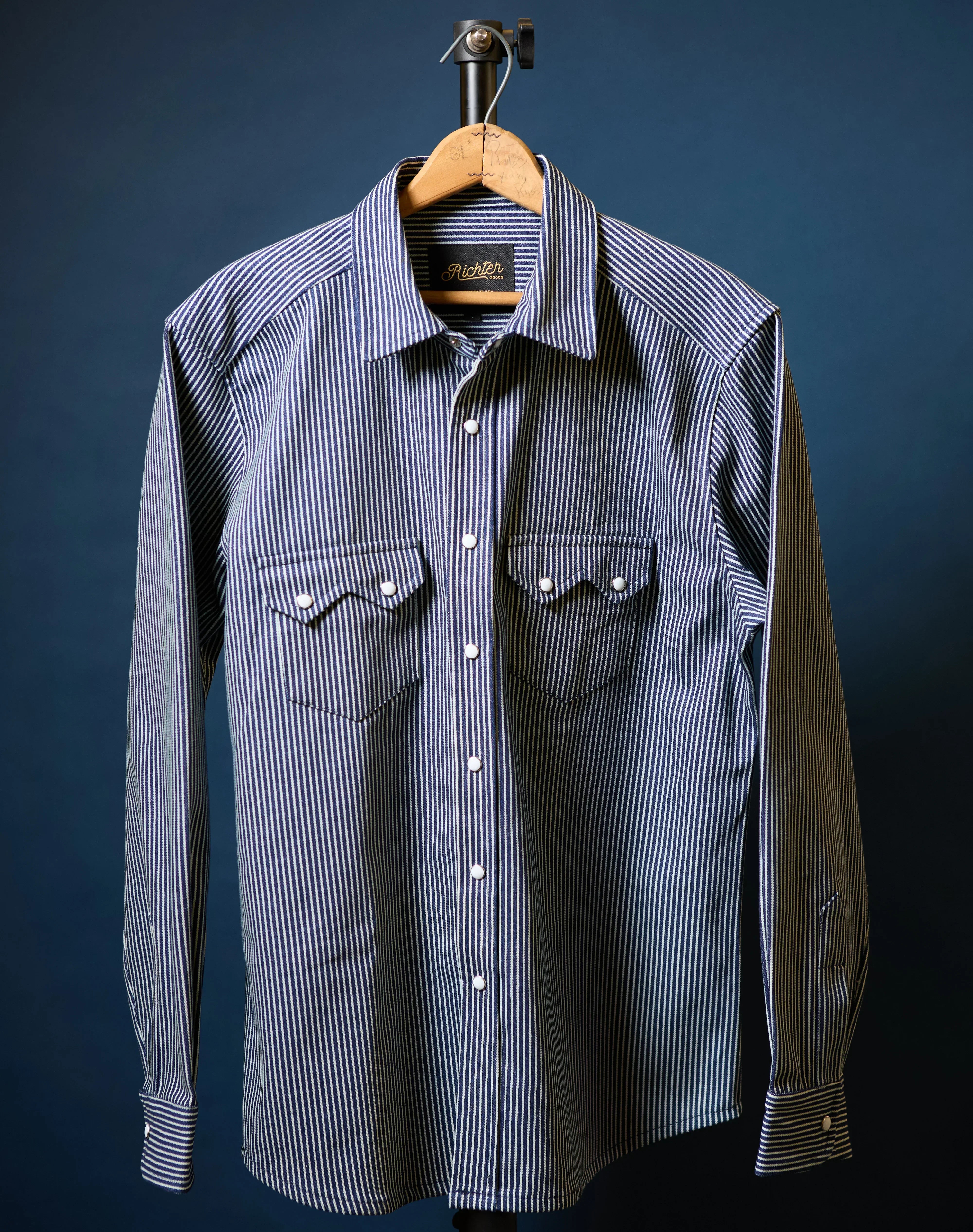 Richter179a front, men's striped long sleeve western pearl snap shirt on hanger