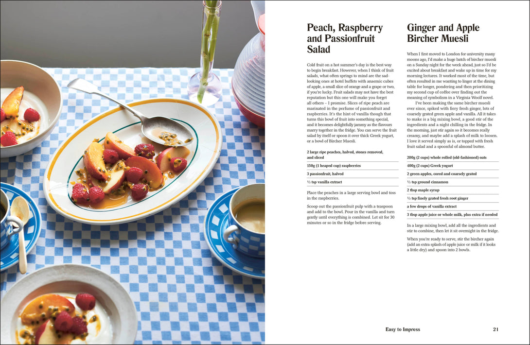 Dessert dish with peach, raspberry, and passionfruit salad on a checkered tablecloth.