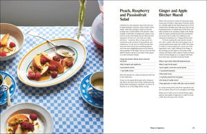 Dessert dish with peach, raspberry, and passionfruit salad on a checkered tablecloth.