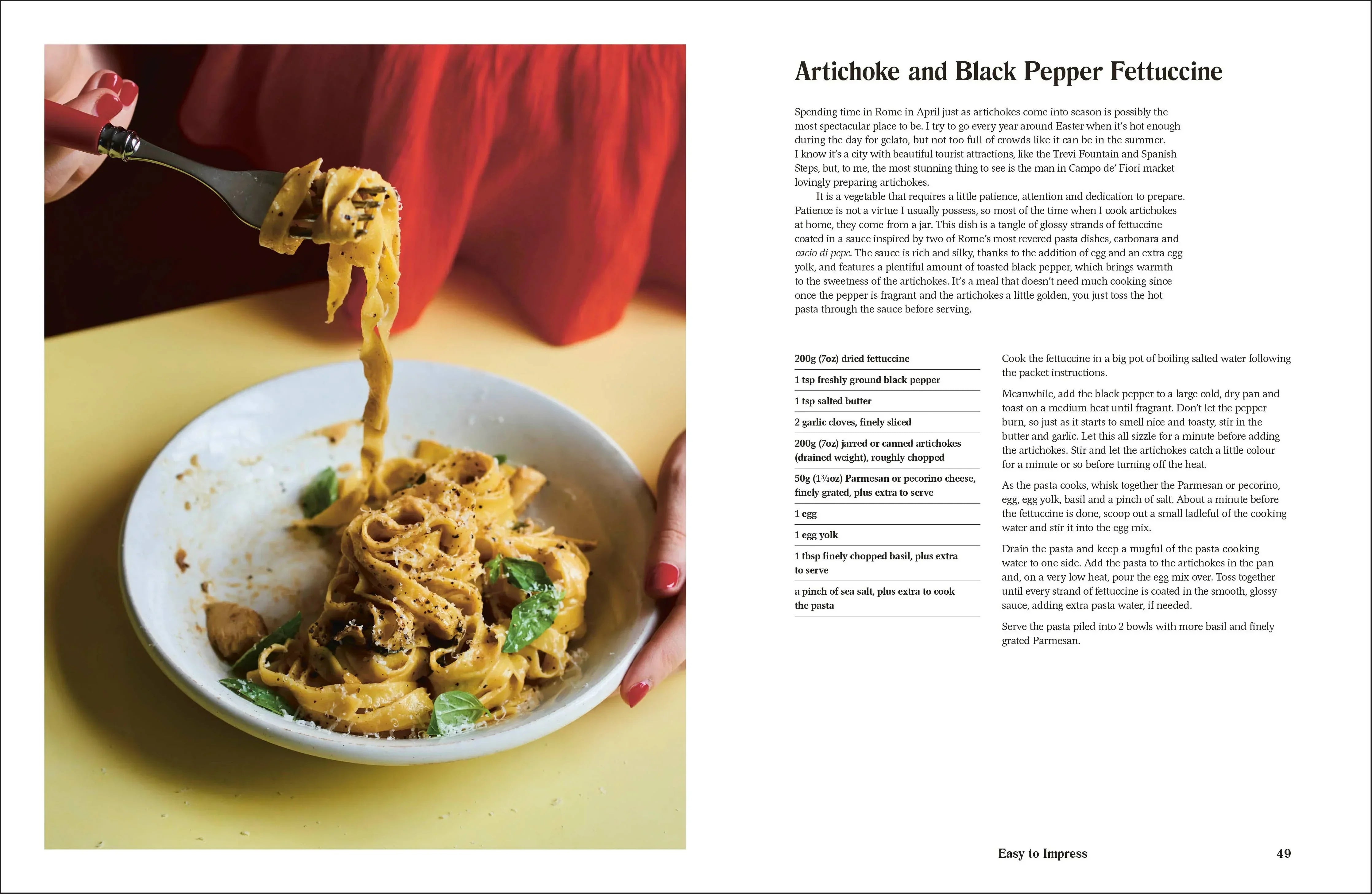 Plate of pasta with a fork, next to a recipe card for Artichoke and Black Pepper Fettuccine.