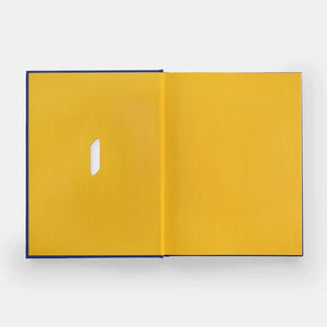 Open yellow book with a blue spine on a white background