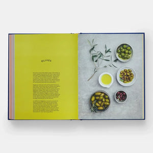 Book open to a page about olives with images of different types of olives on a gray background.