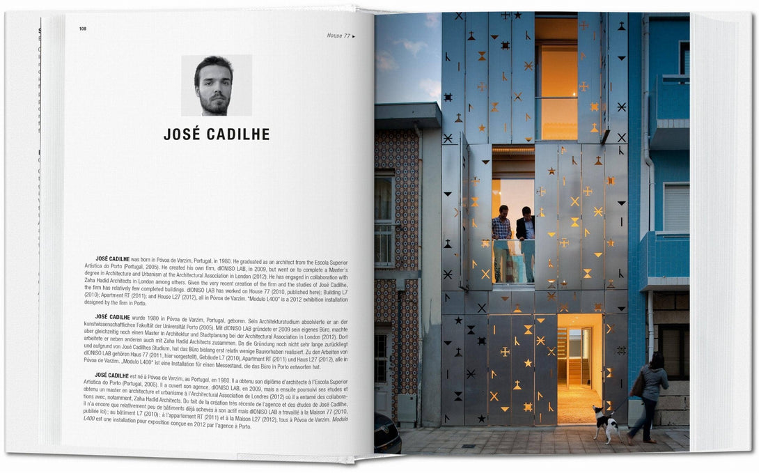 Open book showing a page with text and a photograph of a building with decorative metalwork.