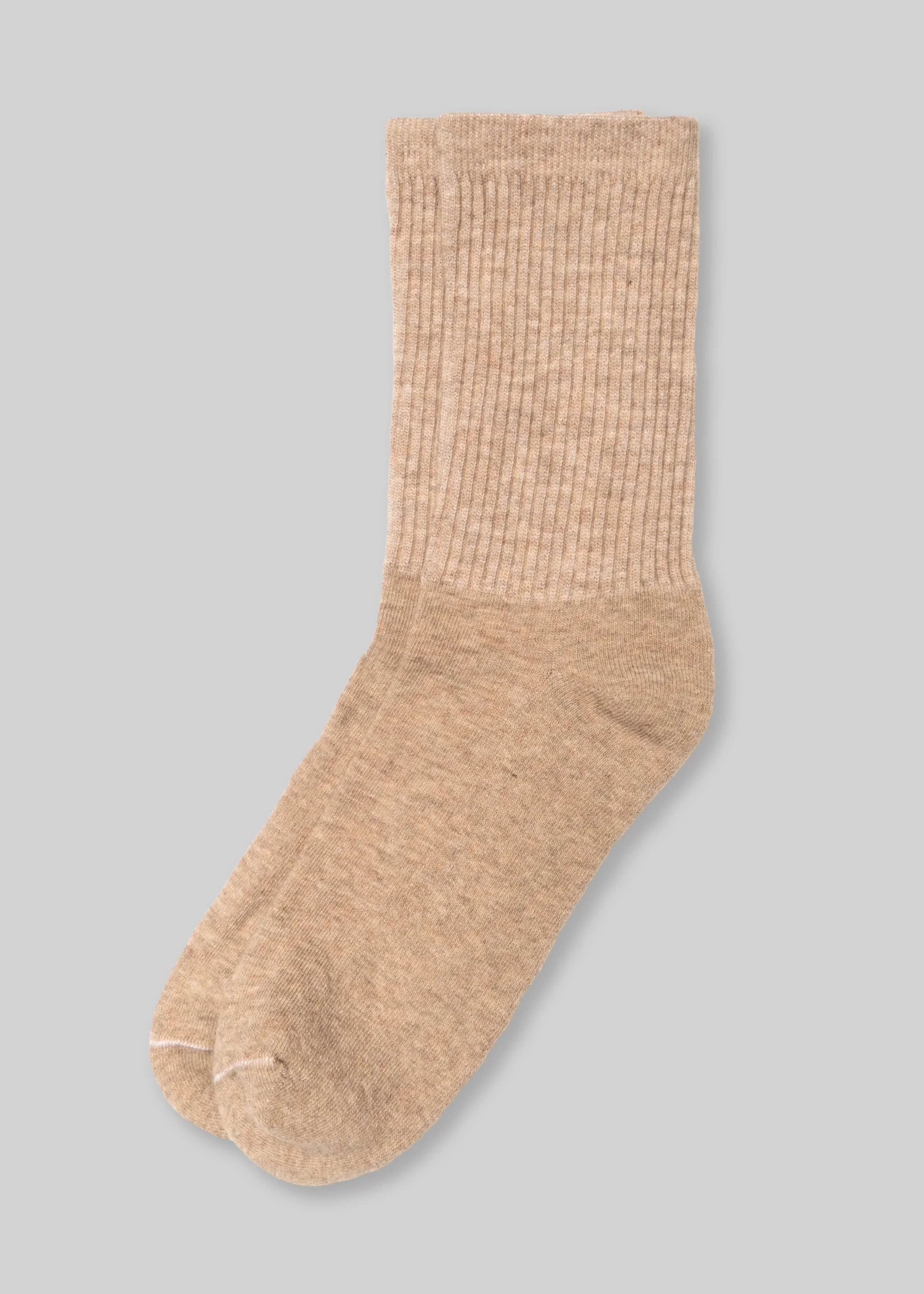 c2e41e6bcbac1de70c0f5df62aeeec654601ec90f1e00a2f41370a95004d8cab front view, beige crew sock on gray background