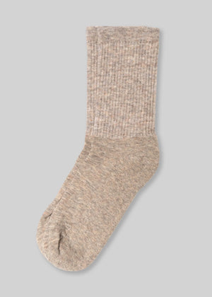 front beige ribbed wool sock on light grey background